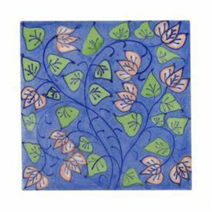 Pink flower and green leaves with blue pottery tile