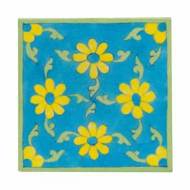 Yellow flower and lime green leaves with turqouise tile