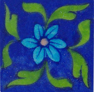 Turquoise flower and green leaves on blue tile