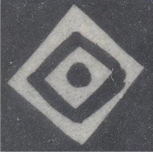 White square design on black tile