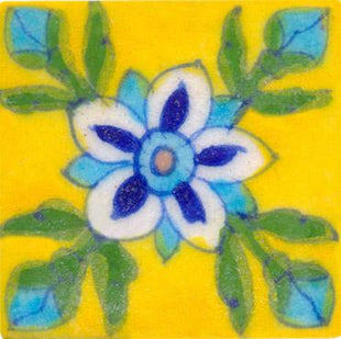 white, blue and turquoise flower wih green leaves on yellow tile