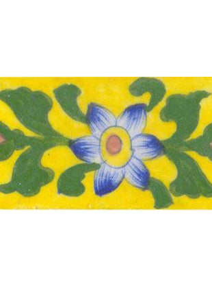blue white shaded flower with big green leaves on yellow tile 2x4