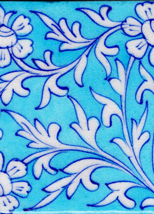 White Flowers and White Leaves Design On Turquoise Tile