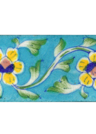 Two Yellow Flowers With Green leaves On Turquoise Base Tile