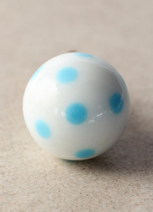 White Round Shaped Door Knob With Turquoise Polka-Dots