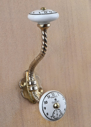 Black Clock on a White Ceramic Knob With Metal Wall Hanger