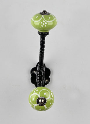 White Flower Design on Green Base Knob With Metal Wall Hanger