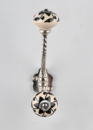 Round Black Flower Design on Off white Knob With Metal Wall Hanger