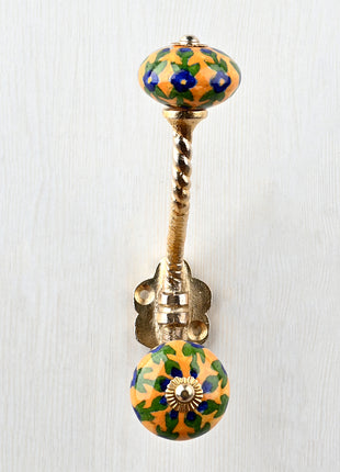 Blue Flower And Leaf Design On Yellow Knob With Metal Wall Hanger