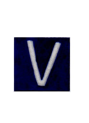 White V alphabet blue tile (2x2)