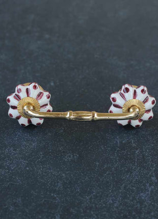 White Cabinet Pull With Maroon Floral Design
