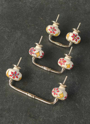 Red and Yellow Flower Design on a White Cabinet Pull