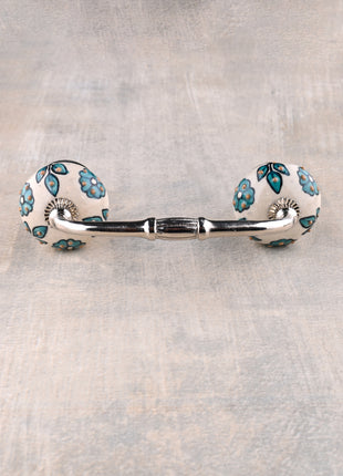 Teal Color Flowers And Petals On White Ceramic Cupboard Pull