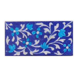 Turquoise flower and blue tile.